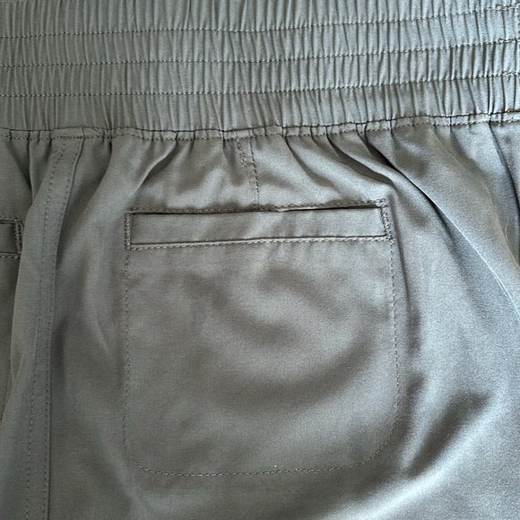 Green athletic skirt with under shorts. Multiple pockets. Size small - Picture 2 of 7